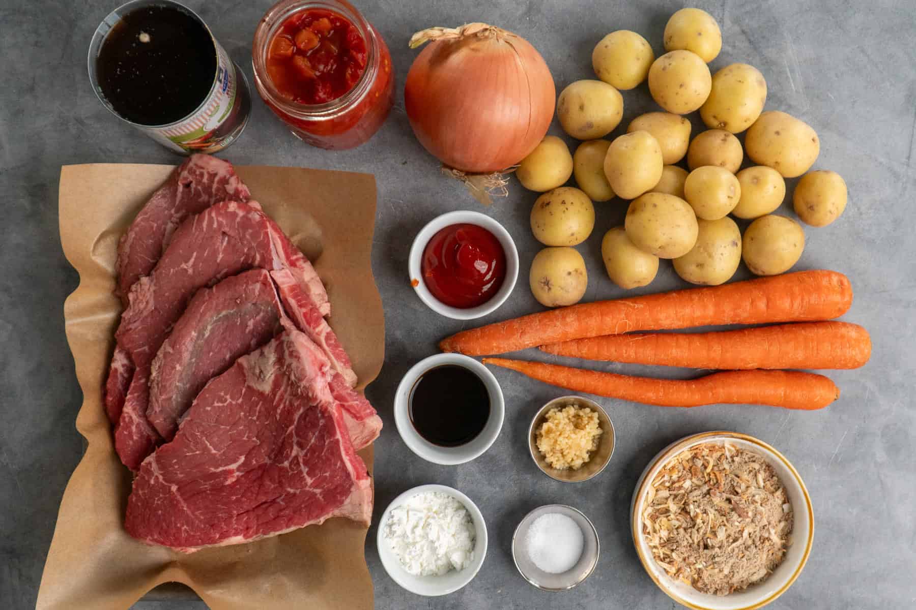 Ingredients to make swiss steak on the table before preparing.