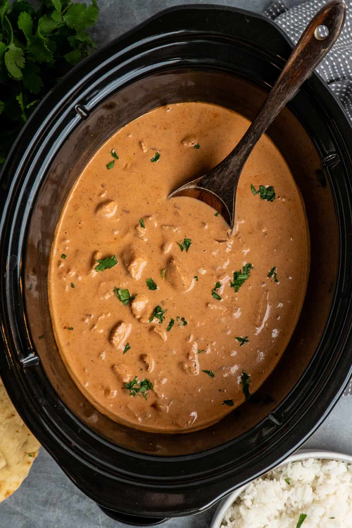 Cooked tikka masala in a crock pot ready to be served.