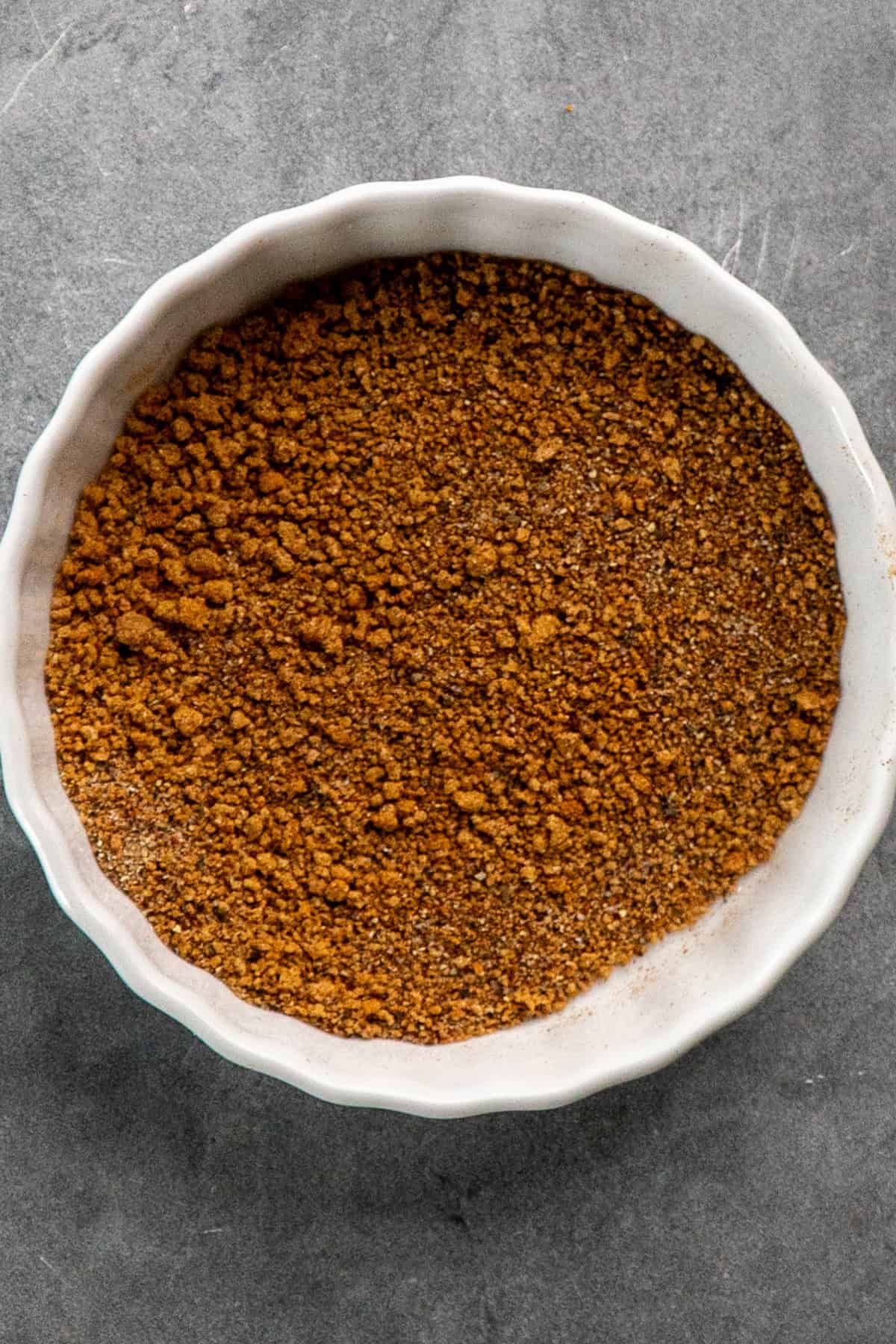 Spices mixed together in a small white bowl.