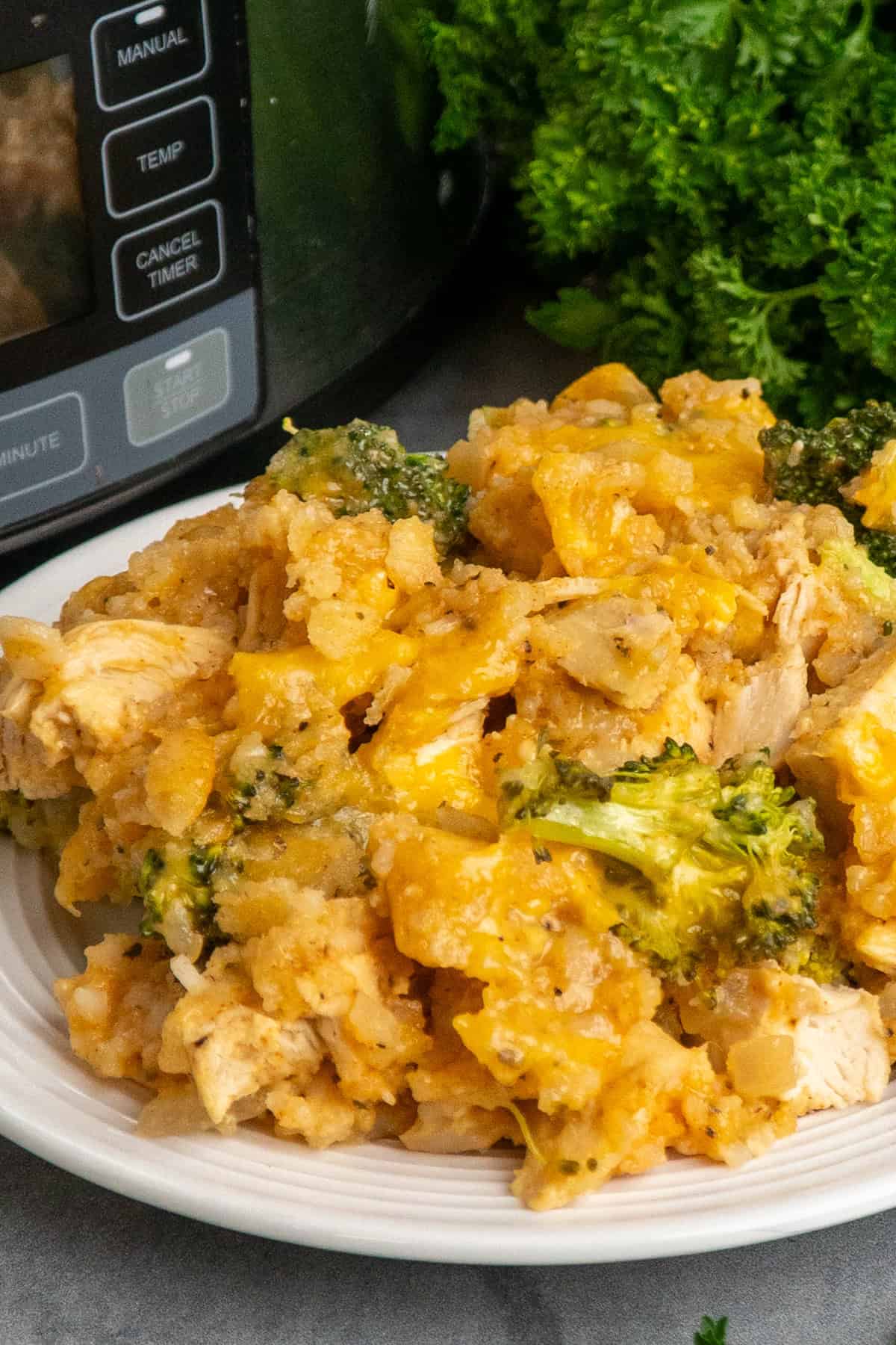 Chicken, broccoli and rice casserole on a white plate.