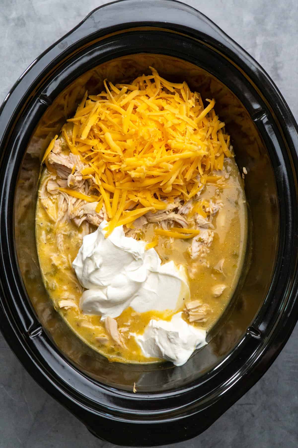 Cheddar cheese, sour cream and shredded chicken in green chile sauce.
