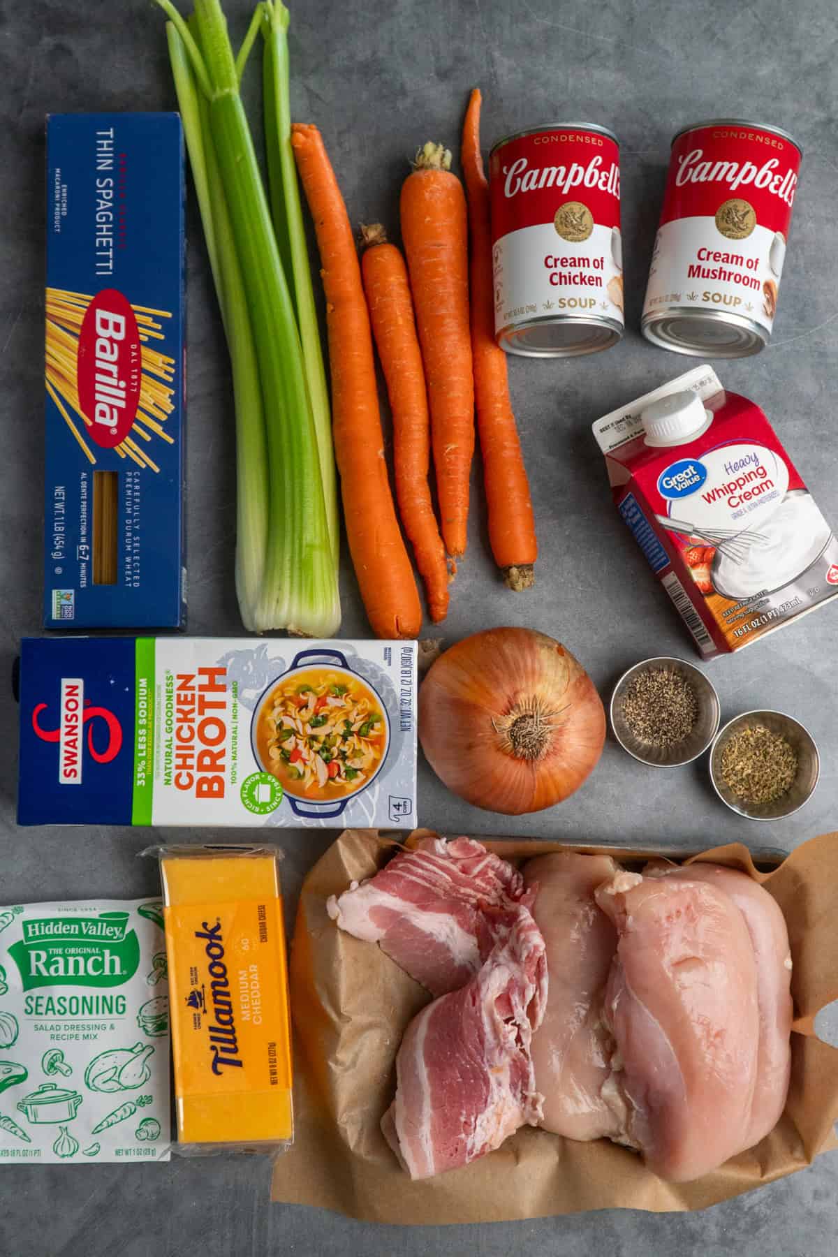 Ingredients to make crack chicken pasta on a gray countertop.