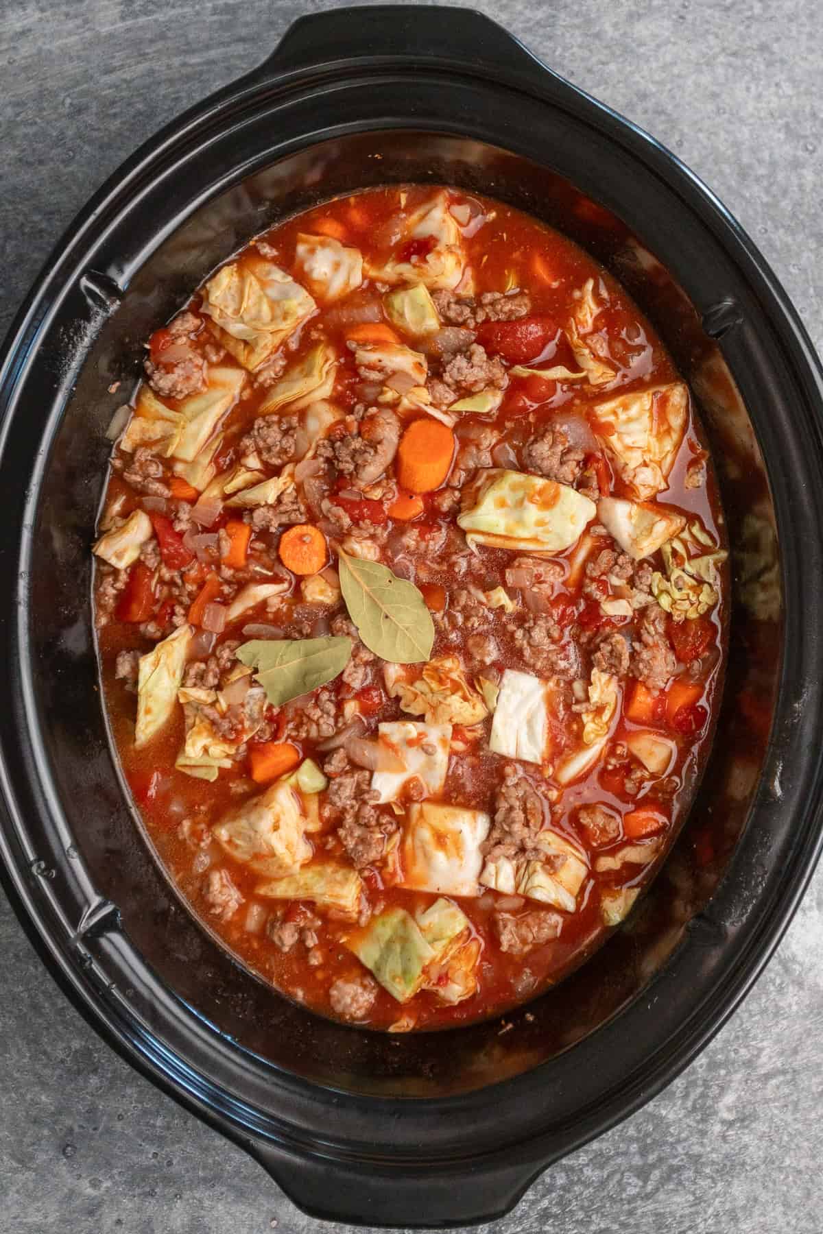 All of the cabbage roll soup added to the slow cooker and mixed together.