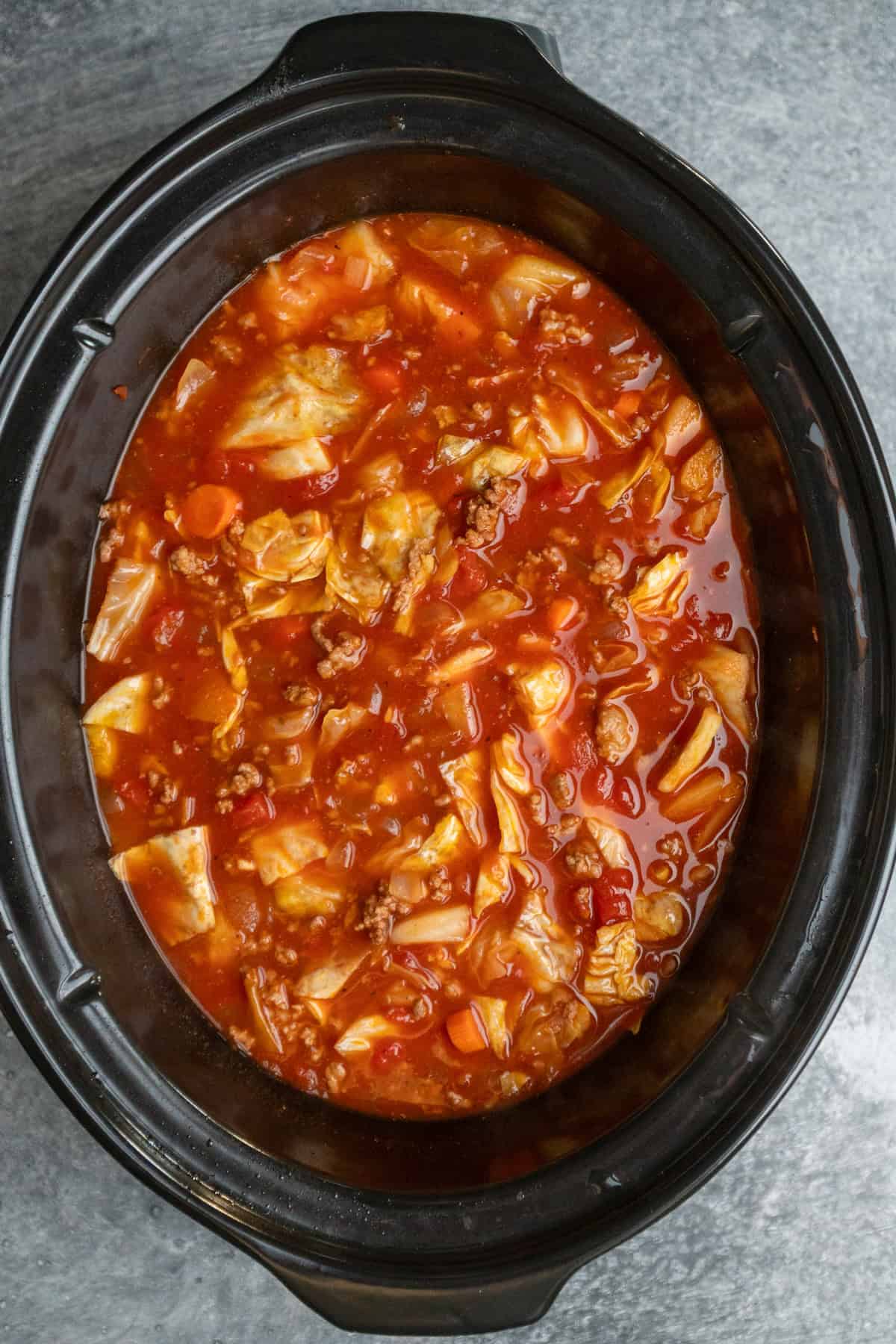 Cabbage roll soup that has been cooked in a slow cooker.