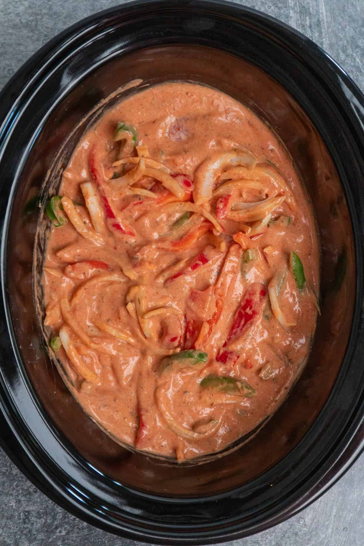 Onions and bell peppers added to the sauce.