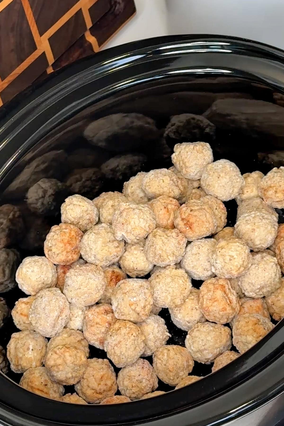 Frozen meatballs in a crock pot.