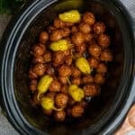 Mississippi meatballs in a black crock pot ready to be served.