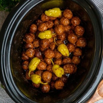 Mississippi meatballs in a black crock pot ready to be served.