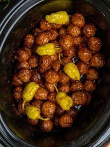 Mississippi meatballs in a black crock pot ready to be served.