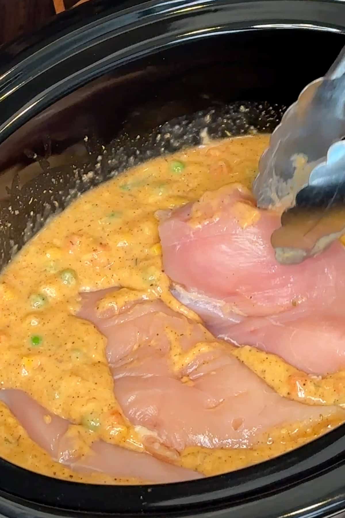 Chicken breasts added to the prepared sauce.