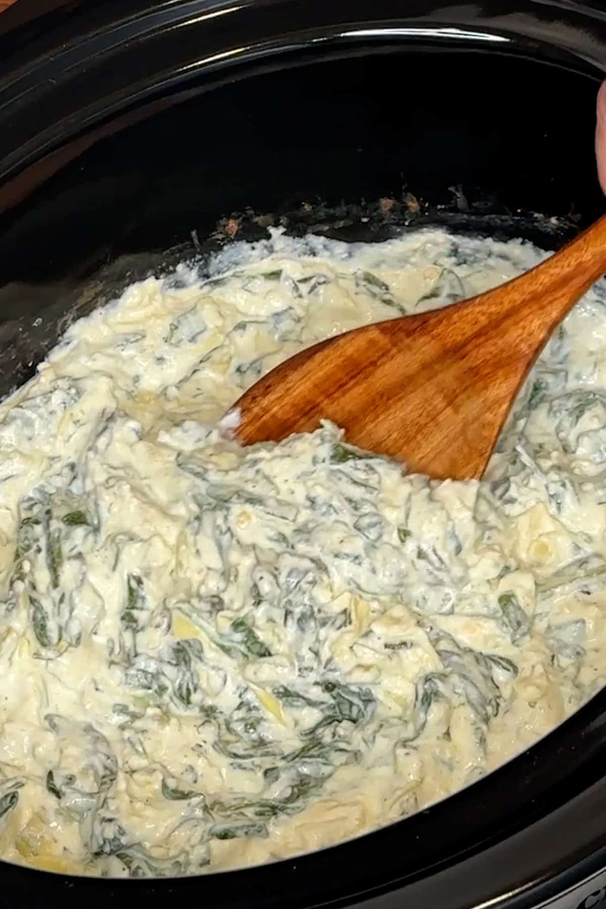 Spinach artichoke dip the had been cooked and mixed together.