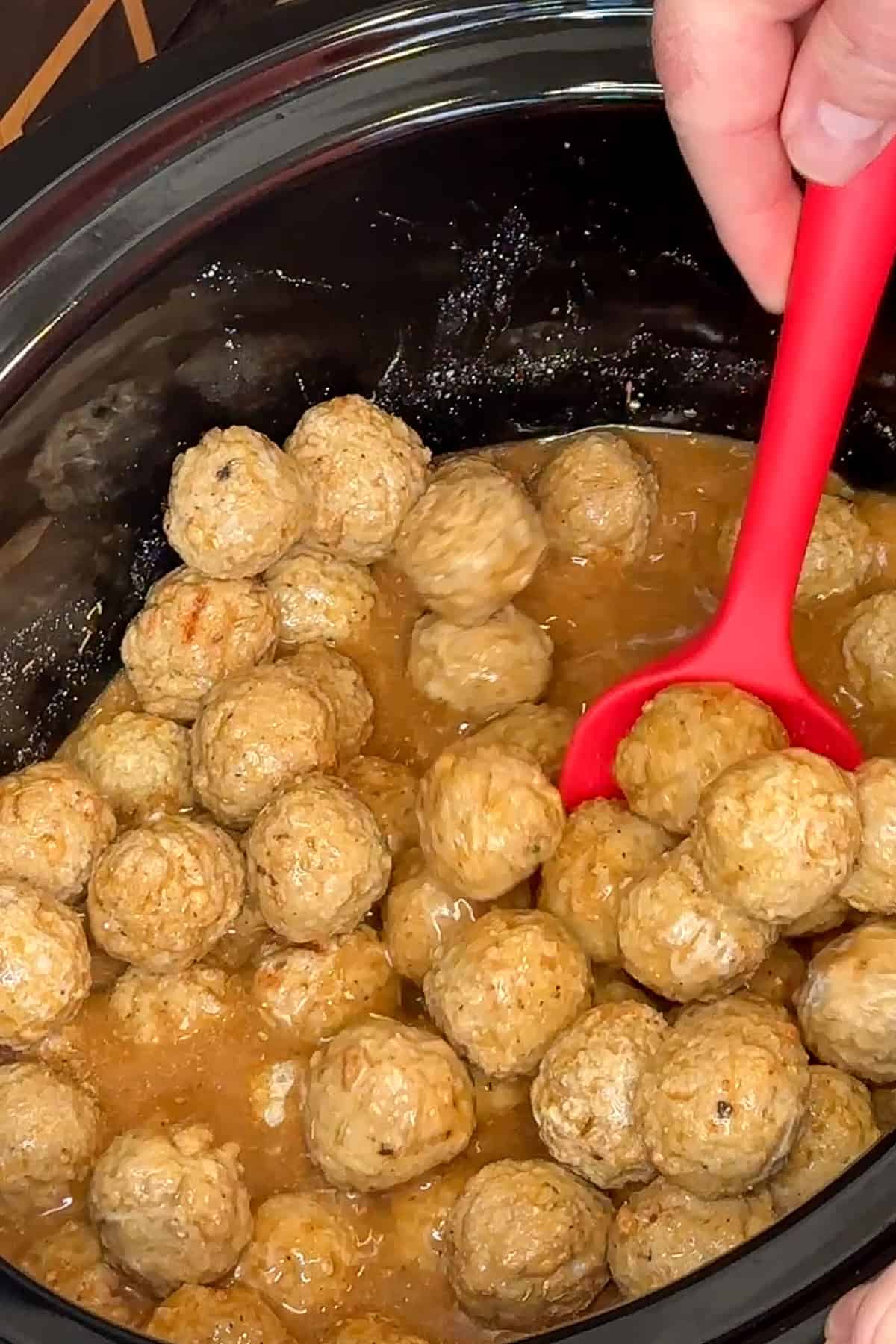 Frozen meatballs added to the sauce and coated ready to be cooked.