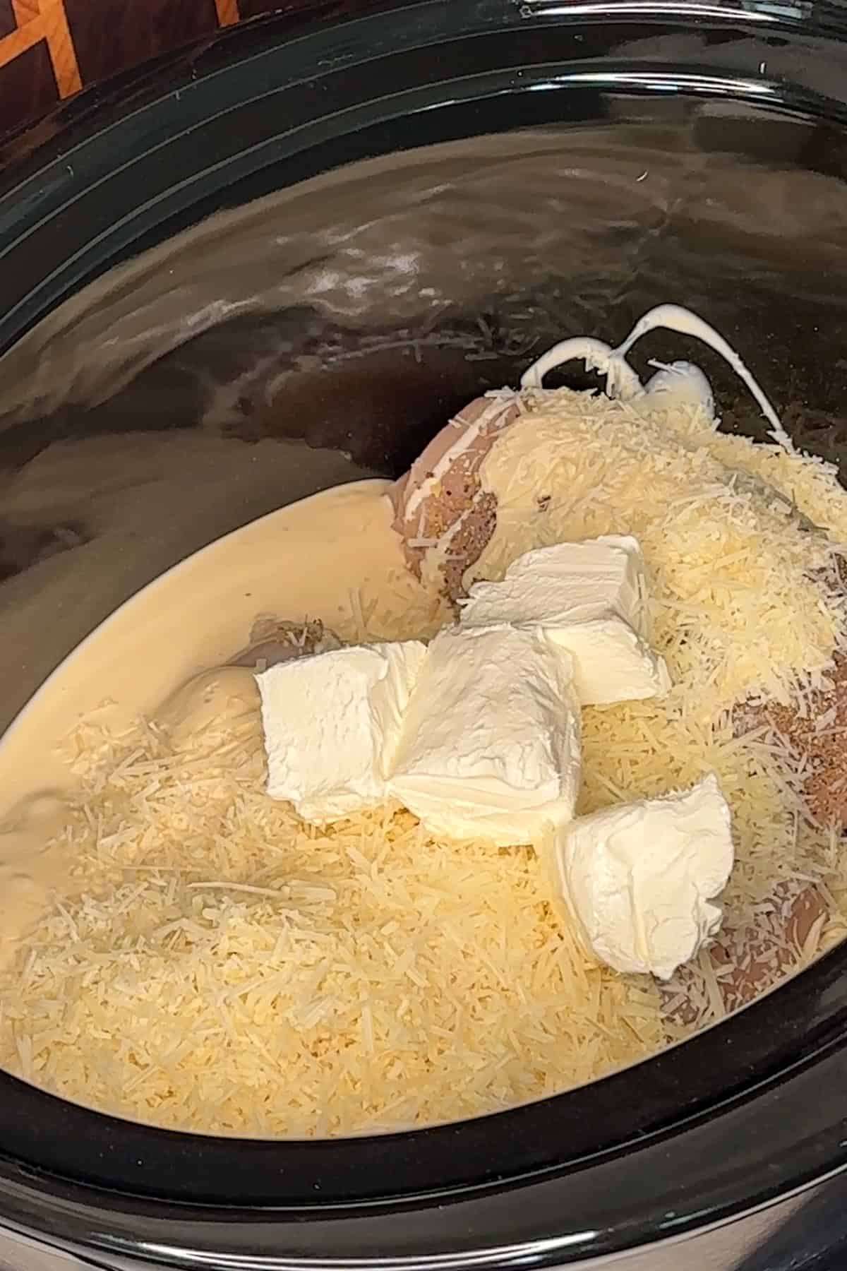 Parmesan cheese and cream cheese added to the chicken and alfredo sauce.